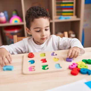 child playing with number blocks 