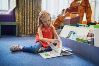 child reading book