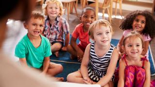 children smiling in classroom