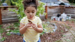latine girl playing outside