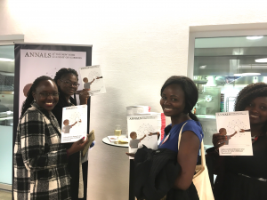 attendees holding the ANYAS special issue at the 71st world health assembly