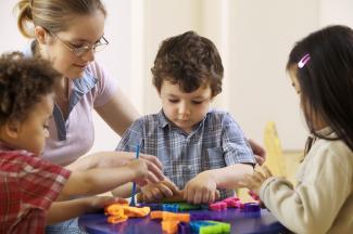 kids playing with play doh