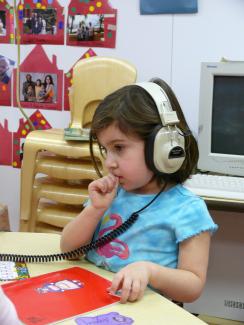 child with headphones image