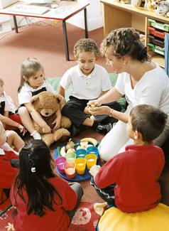 students and teacher during snack time