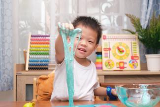 child playing with slime