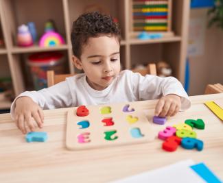 child playing with number blocks 